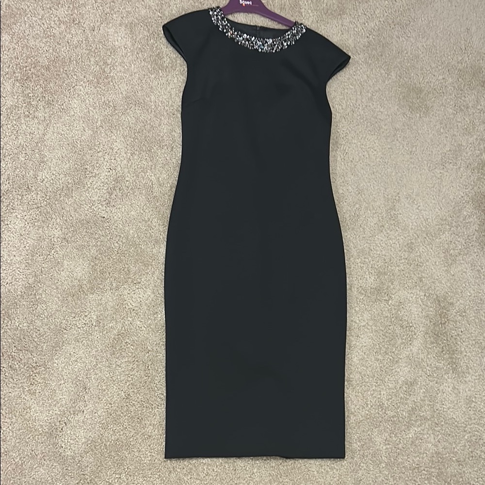 Elegant Black Dress with Embellished Neckline